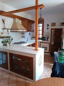 a kitchen with a stove and a counter top at Casa Belvedere in Isnello