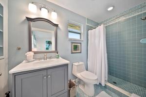 a bathroom with a sink and a toilet and a shower at Henderson home in Sanibel