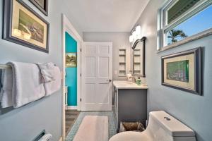 a bathroom with a white toilet and a sink at Henderson home in Sanibel +25 photos