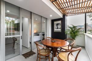 a dining room with a table and chairs at Borbon Suites in Medellín