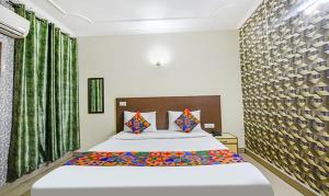 Postel nebo postele na pokoji v ubytování Hotel Smart Stay