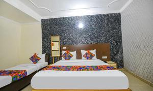 Postel nebo postele na pokoji v ubytování Hotel Smart Stay