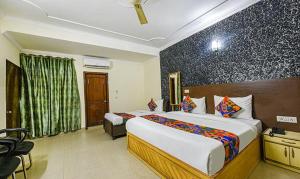 Postel nebo postele na pokoji v ubytování Hotel Smart Stay