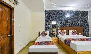 Postel nebo postele na pokoji v ubytování Hotel Smart Stay