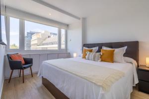 Säng eller sängar i ett rum på Apartamento Plaza Colon Colon II