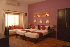 Llit o llits en una habitació de Hotel Henna Jaisalmer