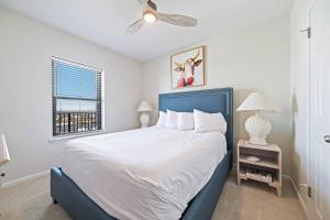 a bedroom with a large bed and a window at Phoenix X 1203 in Perdido Key