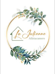 a watercolor laurel wreath in a gold circle frame at La Julienne AC in Naples