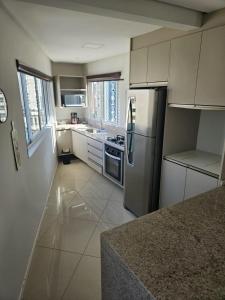 A kitchen or kitchenette at Apartamento alto padrão no 16º andar com 3 quartos TOP