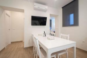 Телевизор и/или развлекательный центр в Hogar del Lirio +21 фотография