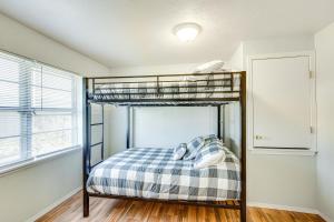 a bedroom with two bunk beds in a room at Pet-Friendly Atoka Vacation Rental with Large Yard! in Atoka