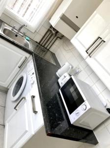 an overhead view of a kitchen with a microwave at Ac lounge 115 1-Bed Apartment in Rochford in Rochford
