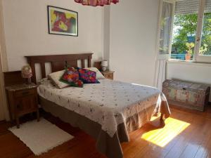 Postel nebo postele na pokoji v ubytování en el corazón del Barrio Sur