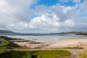 a view of a beach with the ocean at Balnakeil House in Balnakeil