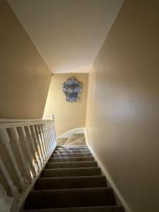 a staircase in a house with a stair case at Beautiful two bed home in Marsh in Lindley