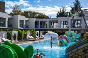 a pool at a resort with a water park at Medite Spa Resort and Villas in Sandanski