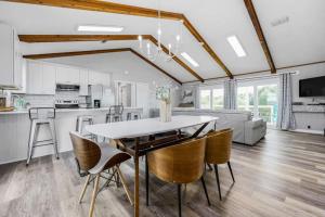 a kitchen and living room with a table and chairs at The Blue Bungalow St. George Island in St. George Island