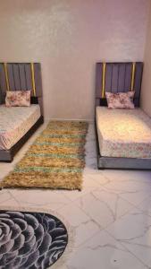 Un pat sau paturi într-o cameră la Apartment close to CMN-Airport Casablanca