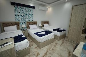 Voodi või voodid majutusasutuse Capital Of Pyramids Hotel toas