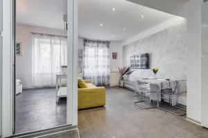 a living room with a couch and a table at Domus In Roma Suite in Rome