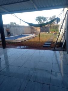 a view of a patio with a hammock in a house at Chácara Incra 9 in Campo Limpo