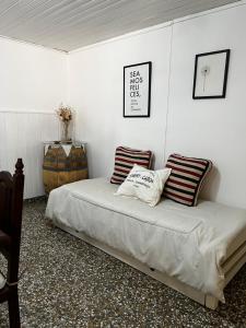 a bed with two pillows on it in a room at Dpto Beltrán in Santa Rosa