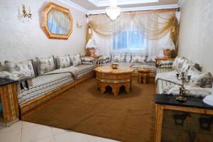 a living room with couches and a table at Home Darna City Center in Tangier