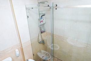 a bathroom with a glass shower with a toilet at Home Darna City Center in Tangier +31 photos