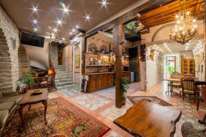 a large living room with a stone wall at Guest house Diabora-Veliko Tarnovo in Veliko Tŭrnovo