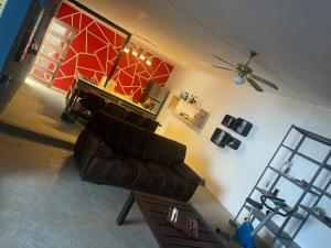 a living room with a couch and a piano at Loft IA79 in San Baltasar