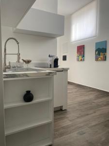 a kitchen with a sink and a counter at Residenza da Zia Donata in Ercolano