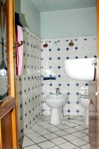 a bathroom with a toilet and a sink at Casa Rosa Atrani in Atrani