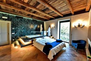 Кровать или кровати в номере In Costa Relais & Luxury Suites