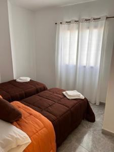 Ліжко або ліжка в номері Apartamento en Los cristianos 2 habitaciones 4 huespedes Vv Elenita