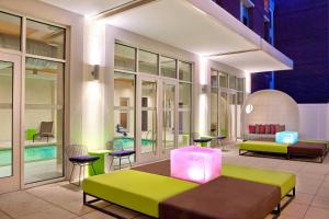 a room with two beds and a pool at Aloft Richmond West Short Pump in Short Pump