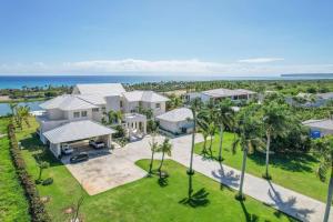 an aerial view of a house with the ocean in the background at Villa Okyanus with Fantastic Ocean View Chef Butler Maid Golf Cart in Punta Cana
