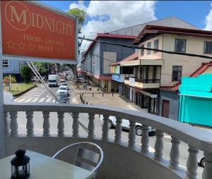 a view of a street from a balcony at HotelMidnight78 in Paramaribo