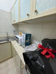 a kitchen with a counter top with a box on it at Studio in Fujairah,CIT&SEA view in Fujairah