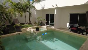 a swimming pool in front of a house at Suites Casa Blanca in La Paz +23 photos