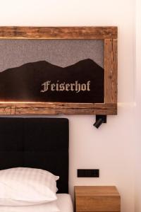 Rúm í herbergi á Feiserhof Navis - Appartements