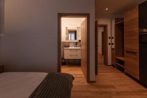 Rúm í herbergi á Feiserhof Navis - Appartements
