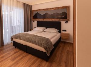 Postel nebo postele na pokoji v ubytování Feiserhof Navis - Appartements