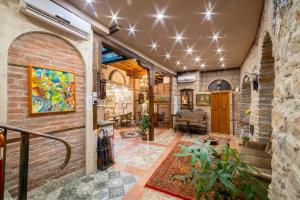 a living room with a brick wall at Guest house Diabora-Veliko Tarnovo in Veliko Tŭrnovo