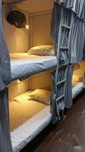 a group of bunk beds in a room at Saffron Dormitory Goregaon East in Mumbai