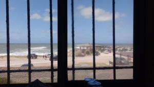 a view of a beach from a window at El Paso in Santa Clara del Mar +5 photos