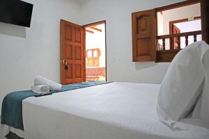 Postel nebo postele na pokoji v ubytování Casa Tatiana
