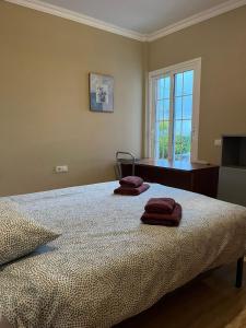 Un pat sau paturi într-o cameră la Casa Romántica