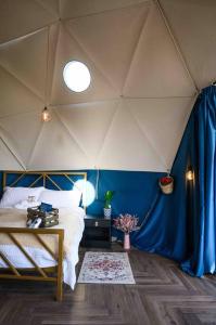 a room with a bed in a tent at Dalriada Den - Luxury GeoDome in Portpatrick