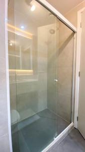 a glass shower stall in a bathroom with at Atlântico Collection in Rio de Janeiro