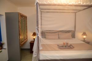 A bed or beds in a room at Susu Villa
